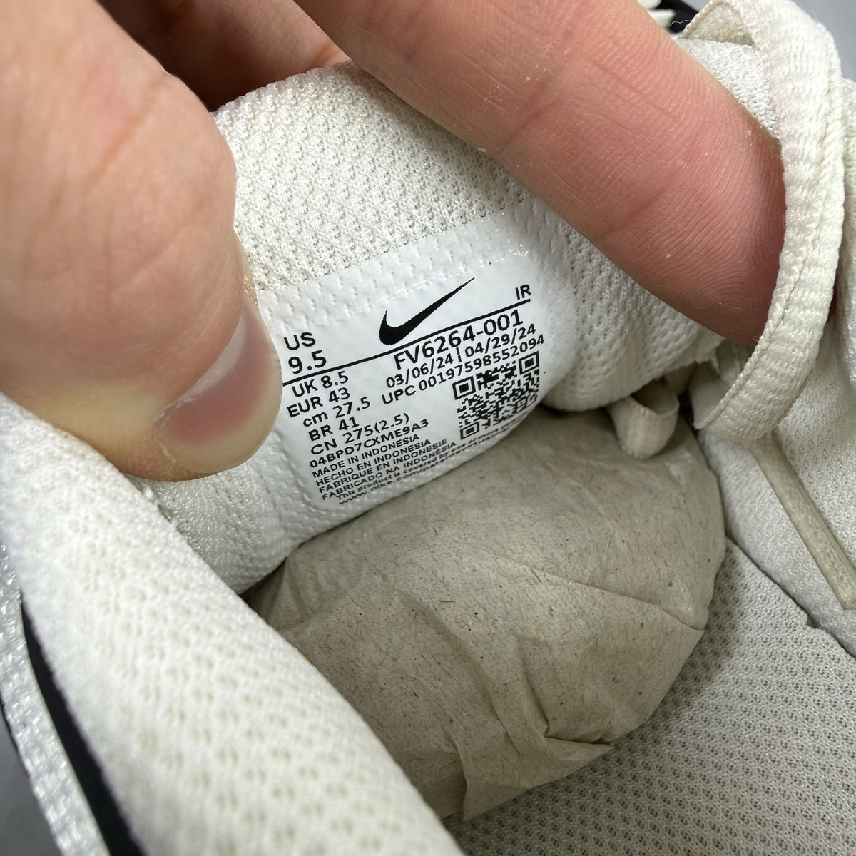 Nike Air Max Plus TN trainers white with black accents and signature logo details.