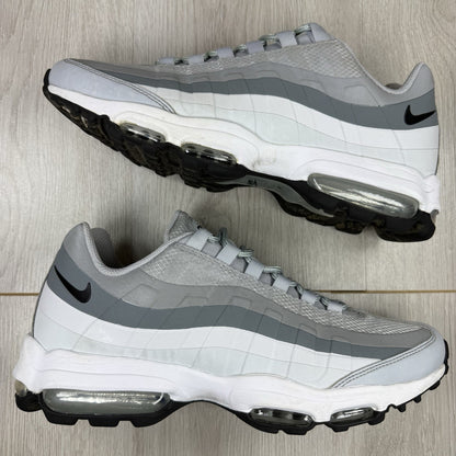 Nike Air Max 95 Ultra grey trainers with white accents and signature logo detailing.