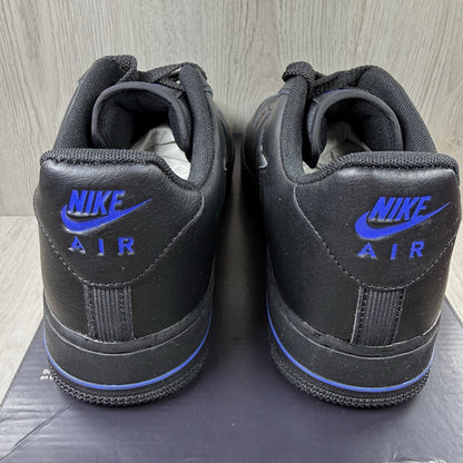 Nike black Air Force 1 Low trainers with jewel swoosh logo and grey accents.