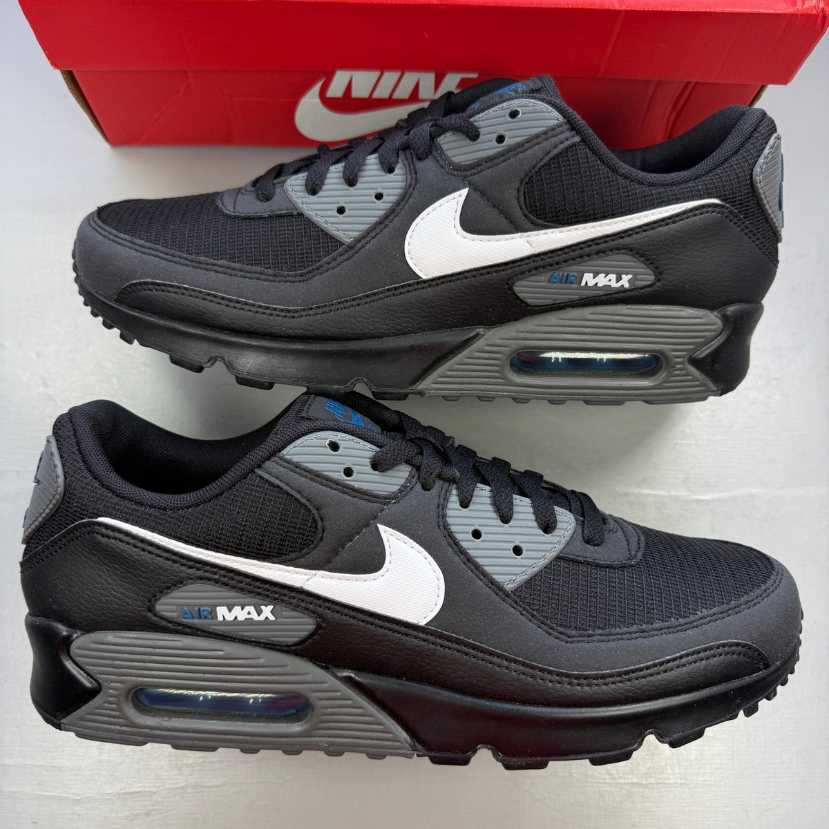 Nike running shoes black with grey accents and logo on the side.