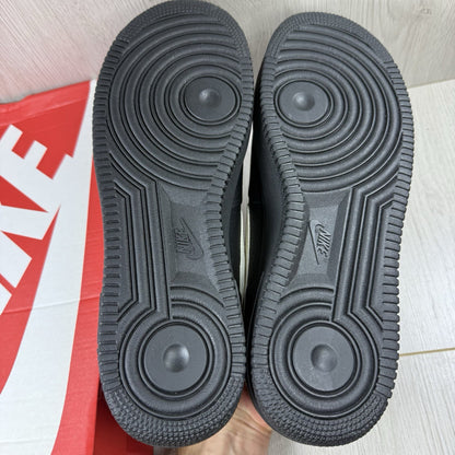 Nike Air Force 1 Low trainers black with white swoosh logo and sail accents.