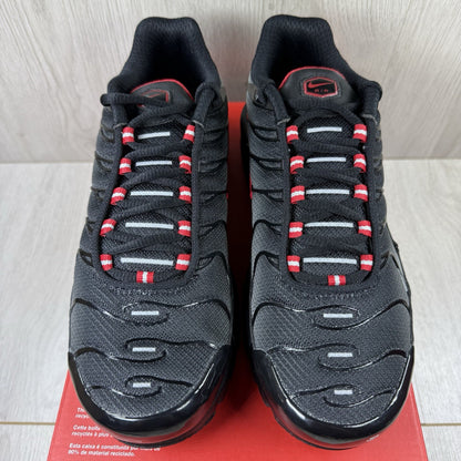 Nike TN Air Max Plus trainers black with red gradient and signature logo design.