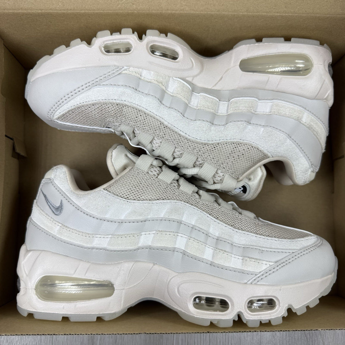 Nike Air Max 95 OG trainers beige with big bubble sole and logo detailing.