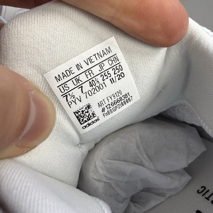 Adidas men's sneakers white with black accents and signature three-stripe logo.