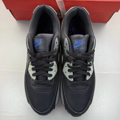 Nike Air Max 90 black trainers with grey and blue accents, featuring iconic logo details.