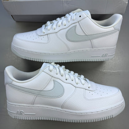 Nike Air Force 1 white trainers with pure platinum grey accents and classic logo.