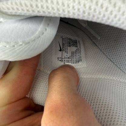 Nike Air Force 1 trainers white with brown accents and signature logo detail.