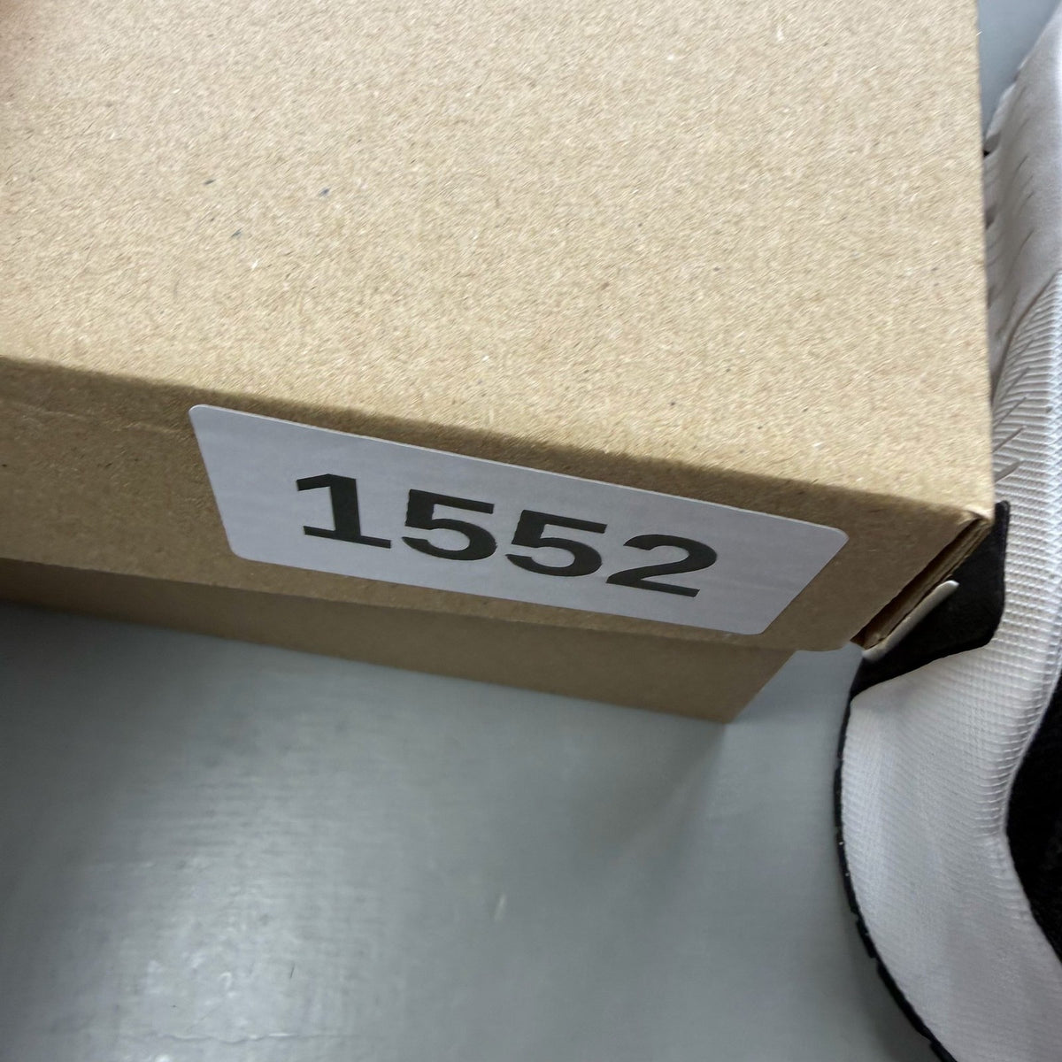 Nike black trainers with white accents and breathable mesh upper.