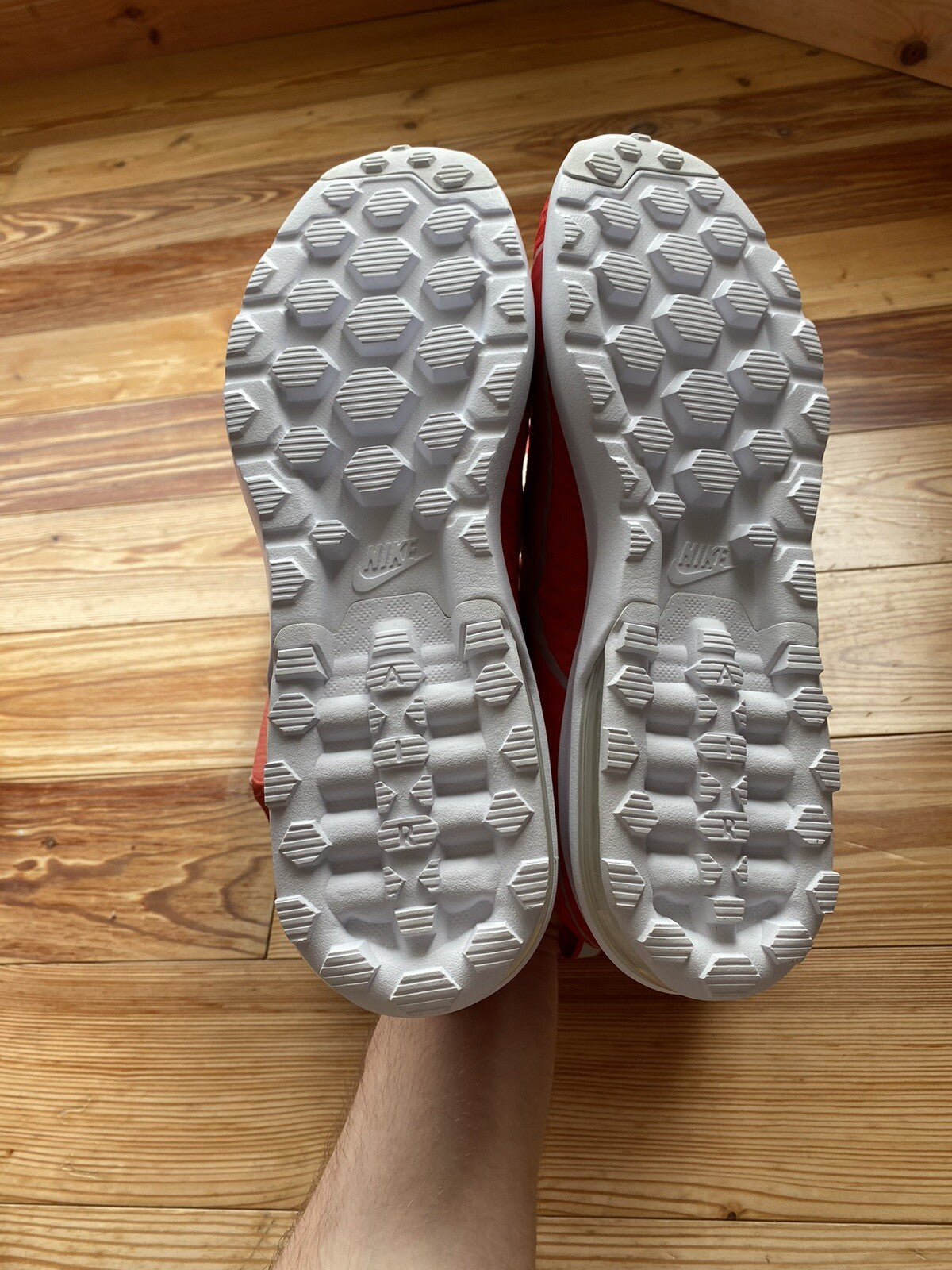Nike Air Max Mercurial 98 trainers university red with white accents and signature logo.