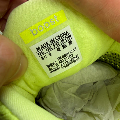 Adidas UltraBoost 1.0 yellow trainers with black and white accents, mesh upper.