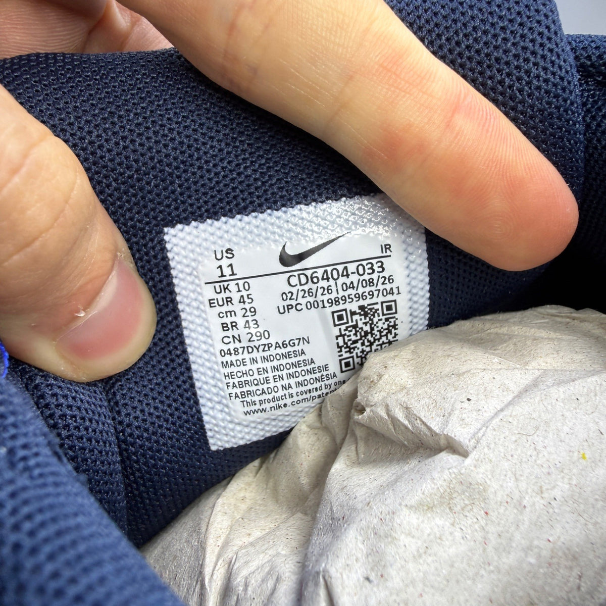 Nike deck shoes grey with blue eclipse accents and white sole, featuring logo detail.