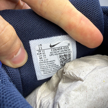 Nike deck shoes grey with blue eclipse accents and white sole, featuring logo detail.