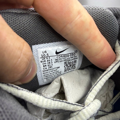 Nike grey blue trainers with pencil point design and logo detail.