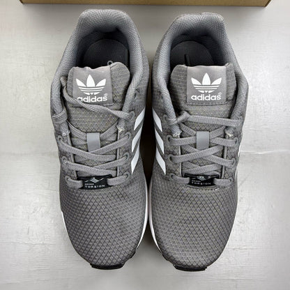 Adidas grey ZX Flux trainers with white accents and logo detail.