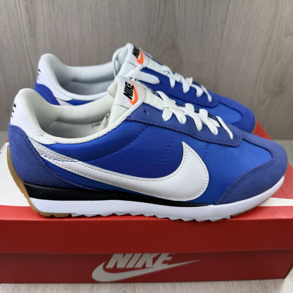 Nike trainers game royal blue with white and black accents, featuring logo detail.