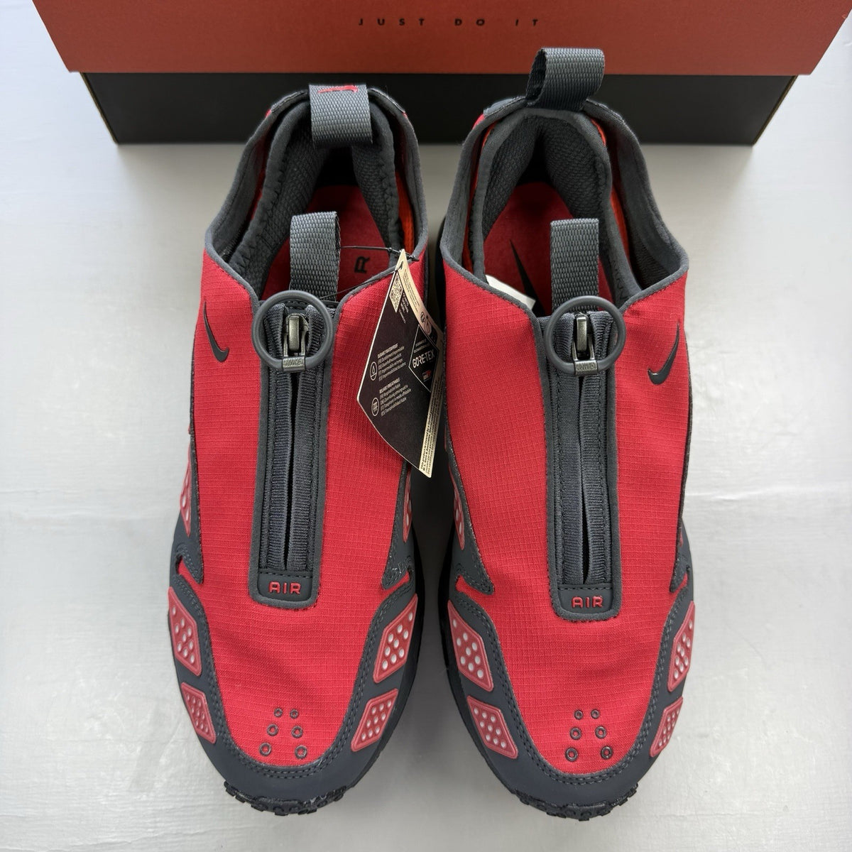 Nike black trainers with Hyper Crimson accents and Gore-Tex material.