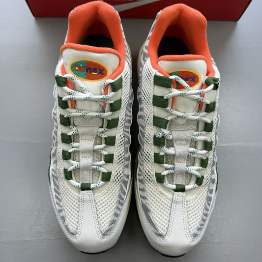 Nike Air Max 95 trainers white with safari green accents and textured material.