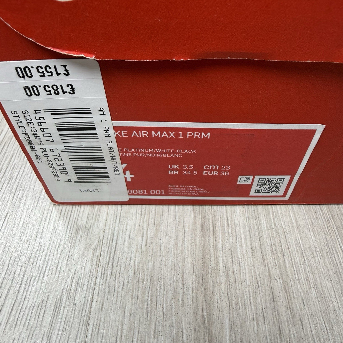 Nike Air Max 1 trainers grey with white accents and signature swoosh logo.