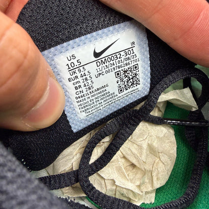 Nike Air Max Plus TN green trainers with lemon twist accents and signature logo.