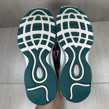 Nike Air Max 97 white trainers with teal accents and reflective detailing.
