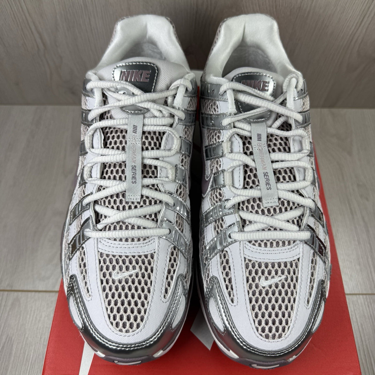 Nike P-6000 trainers grey with platinum violet accents and mesh upper details.