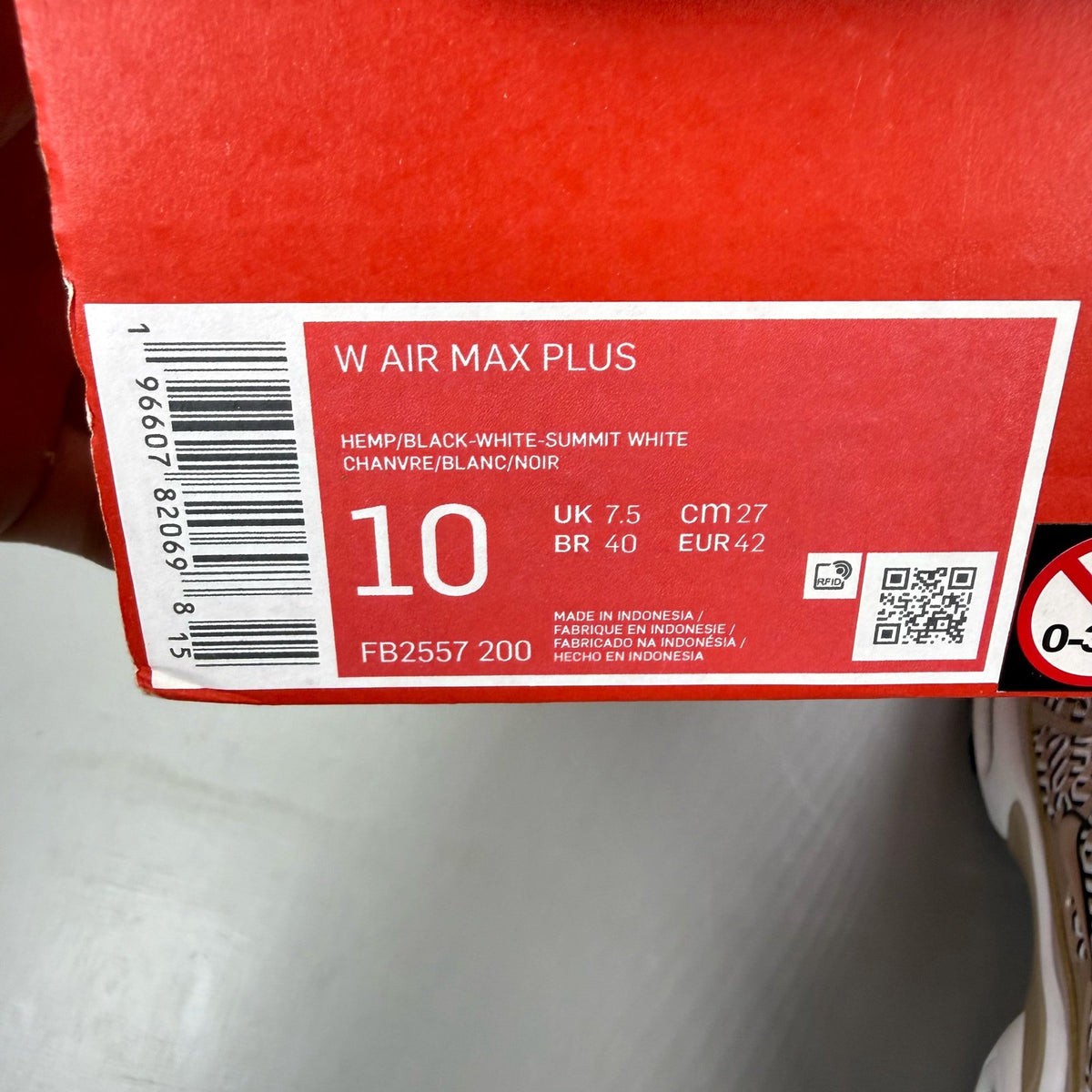 Nike Air Max Plus TN beige trainers with iconic logo and sleek design.