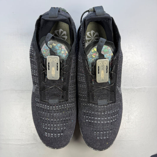 Nike black trainers Flyknit upper with grey accents and Air Max cushioning.