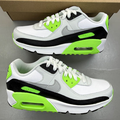 Nike Air Max 90 white trainers with black and lime blast accents, logo on tongue.