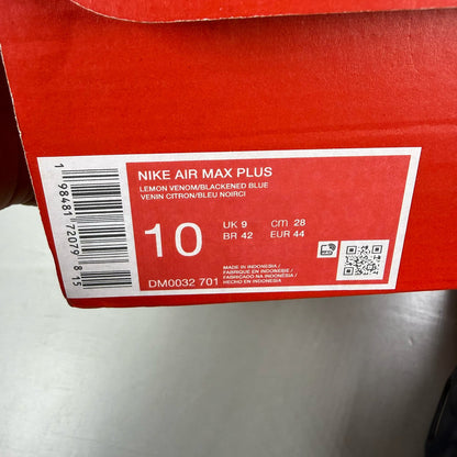 Nike yellow trainers with Hyper Crimson accents and distinctive Air Max Plus design.