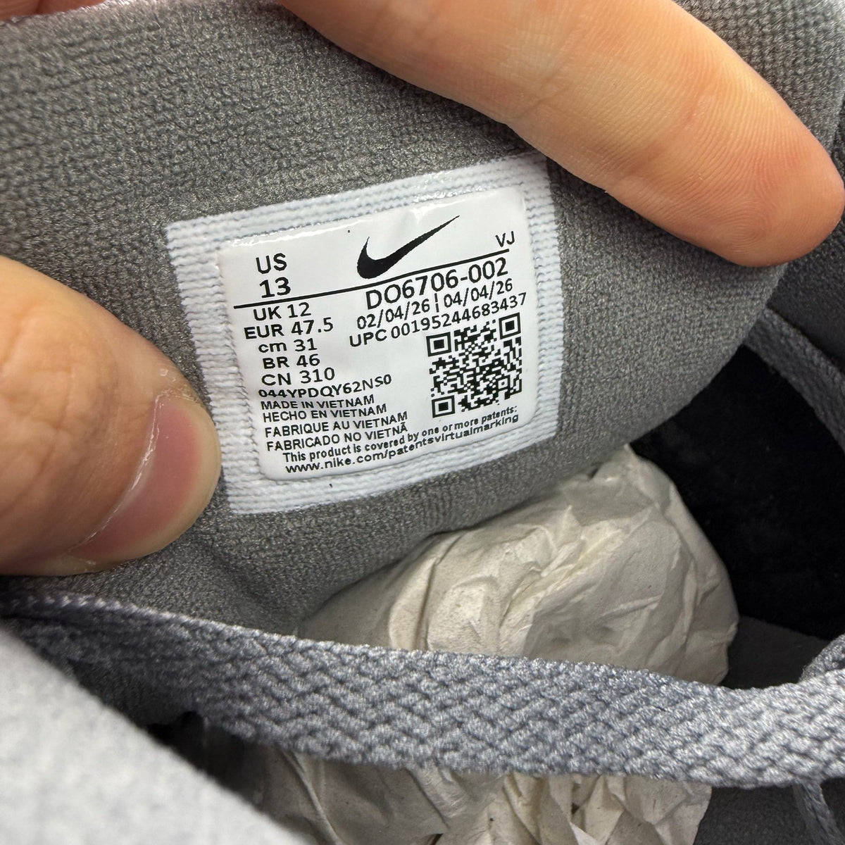 Nike Air Max 90 grey trainers with light blue accents and signature logo.