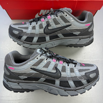 Nike P-6000 trainers grey with pink and black accents, mesh material, logo on tongue.