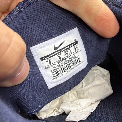Nike deck shoes blue with logo detailing and cushioned sole design.