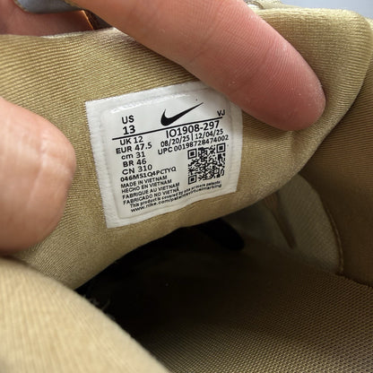 Nike Air Max 90 Drift beige trainers with white accents and logo detailing.