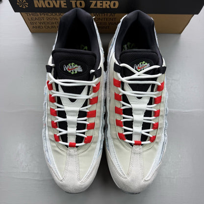 Nike Air Max 95 white trainers with red accents and textured mesh upper.