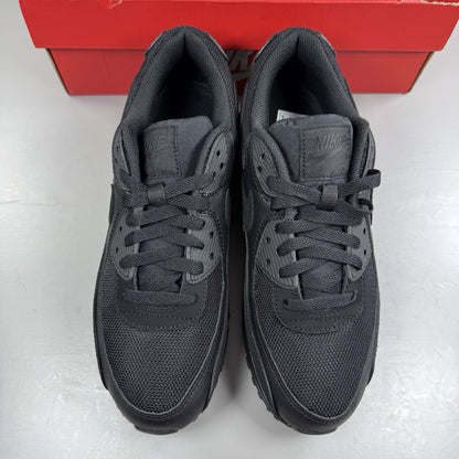 Nike Air Max 90 Recraft black trainers with textured upper and signature swoosh logo.