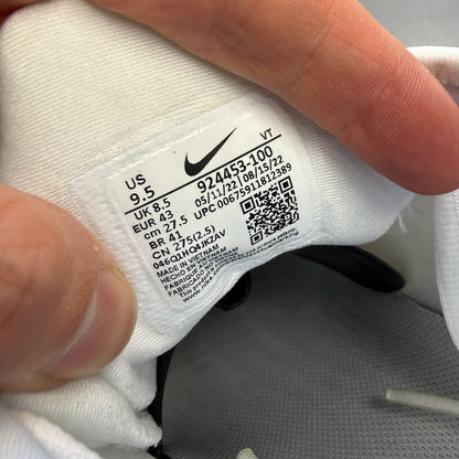 Nike white trainers with Pure Platinum accents and signature logo detailing.