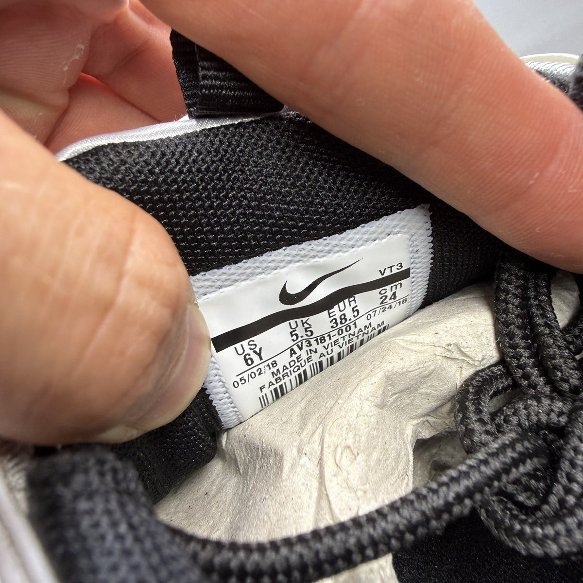 Nike Air Max 97 SE metallic silver trainers with bronze accents and white sole.