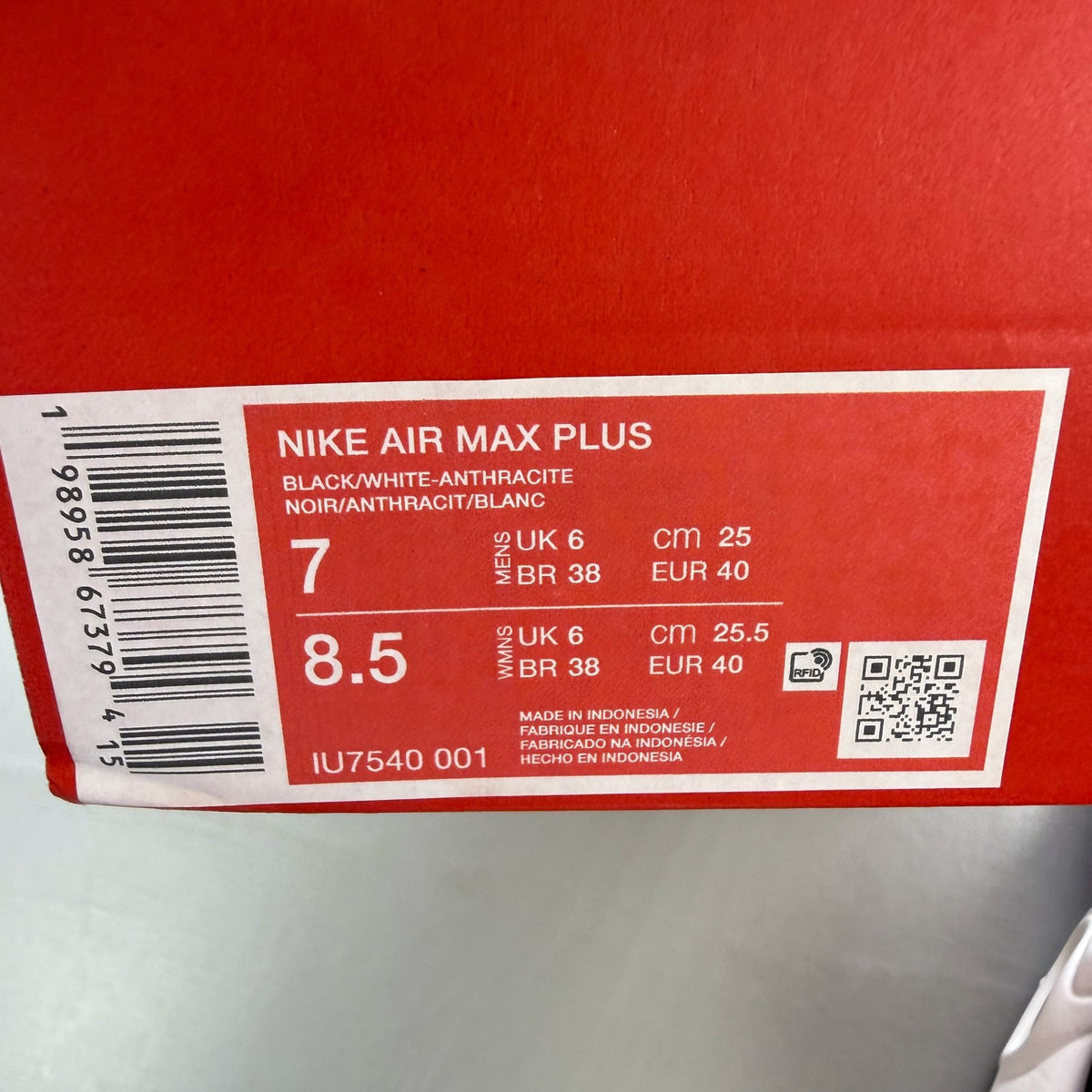 Nike trainers white with pink accents and black detailing, featuring Air Max cushioning.
