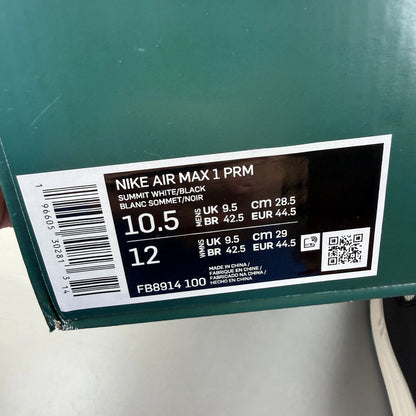Nike Air Max 1 white trainers with LeBron James logo and Liverpool FC details.