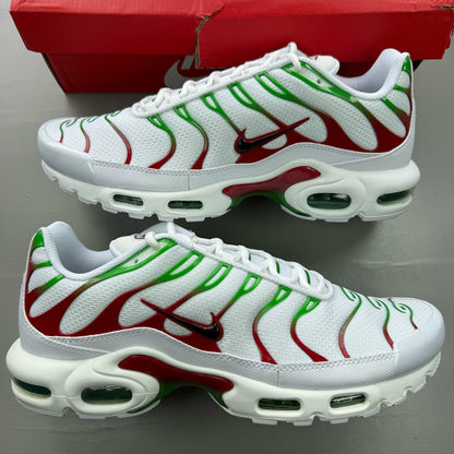Nike Air Max Plus TN white trainers with green and red accents, featuring iconic logo.