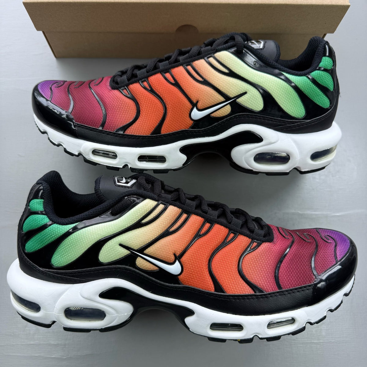 Nike black trainers rainbow gradient design with Viotech accents and Air Max cushioning.