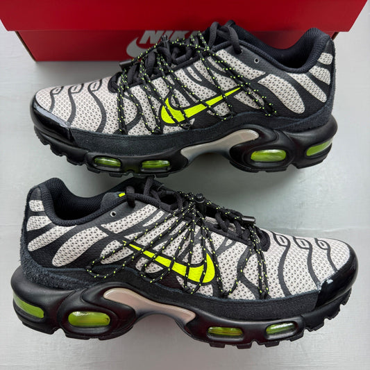 Nike Air Max Plus TN black grey volt with signature logo and unique pattern design.
