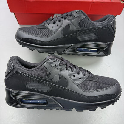 Nike Air Max 90 Recraft black trainers with textured upper and signature swoosh logo.