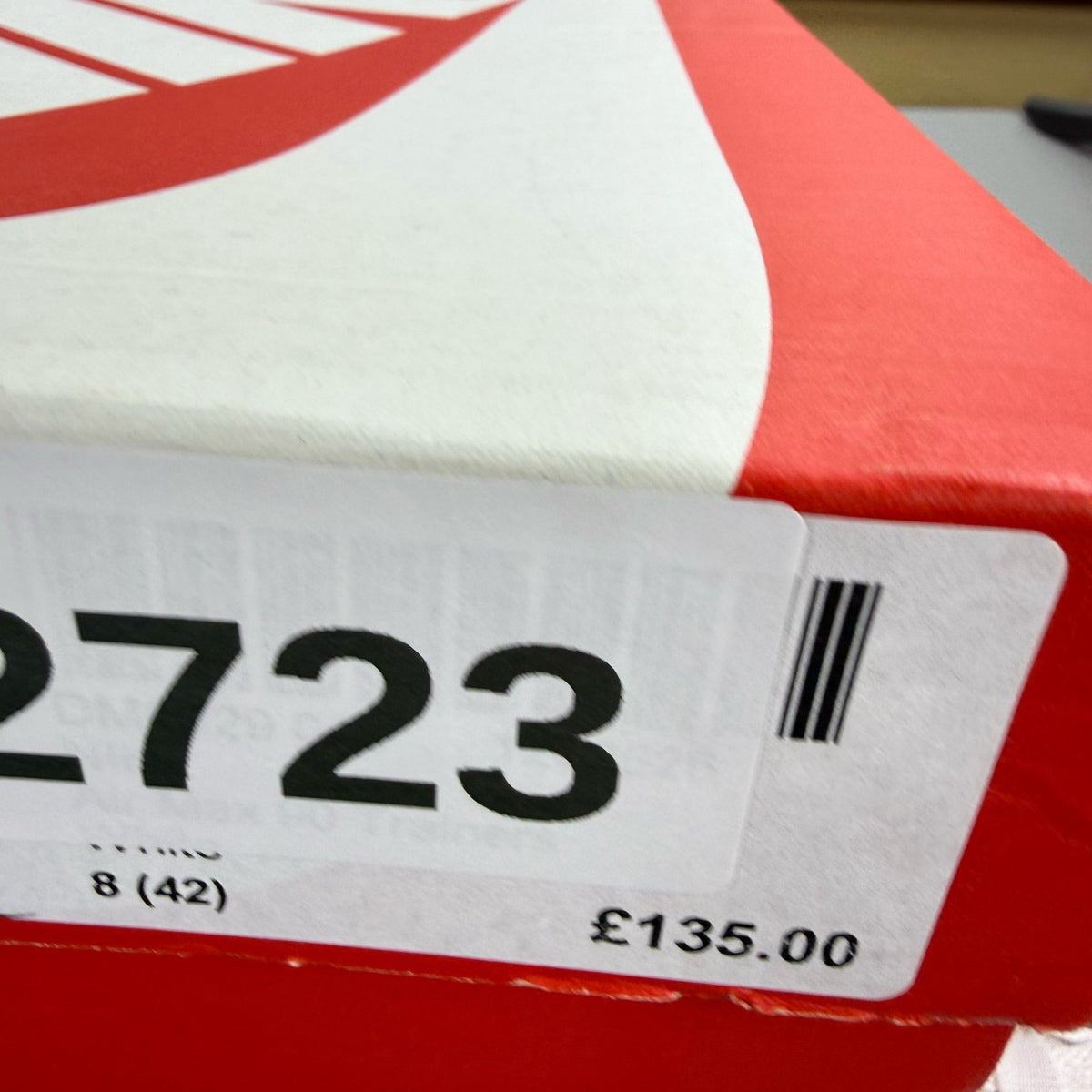 Nike Air Max 90 grey trainers with blue accents and signature swoosh logo.