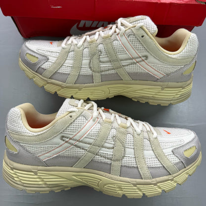 Nike P-6000 grey trainers with mesh upper and subtle logo detailing.