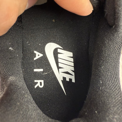 Nike Air Max 98 trainers black with white accents and signature logo detail.