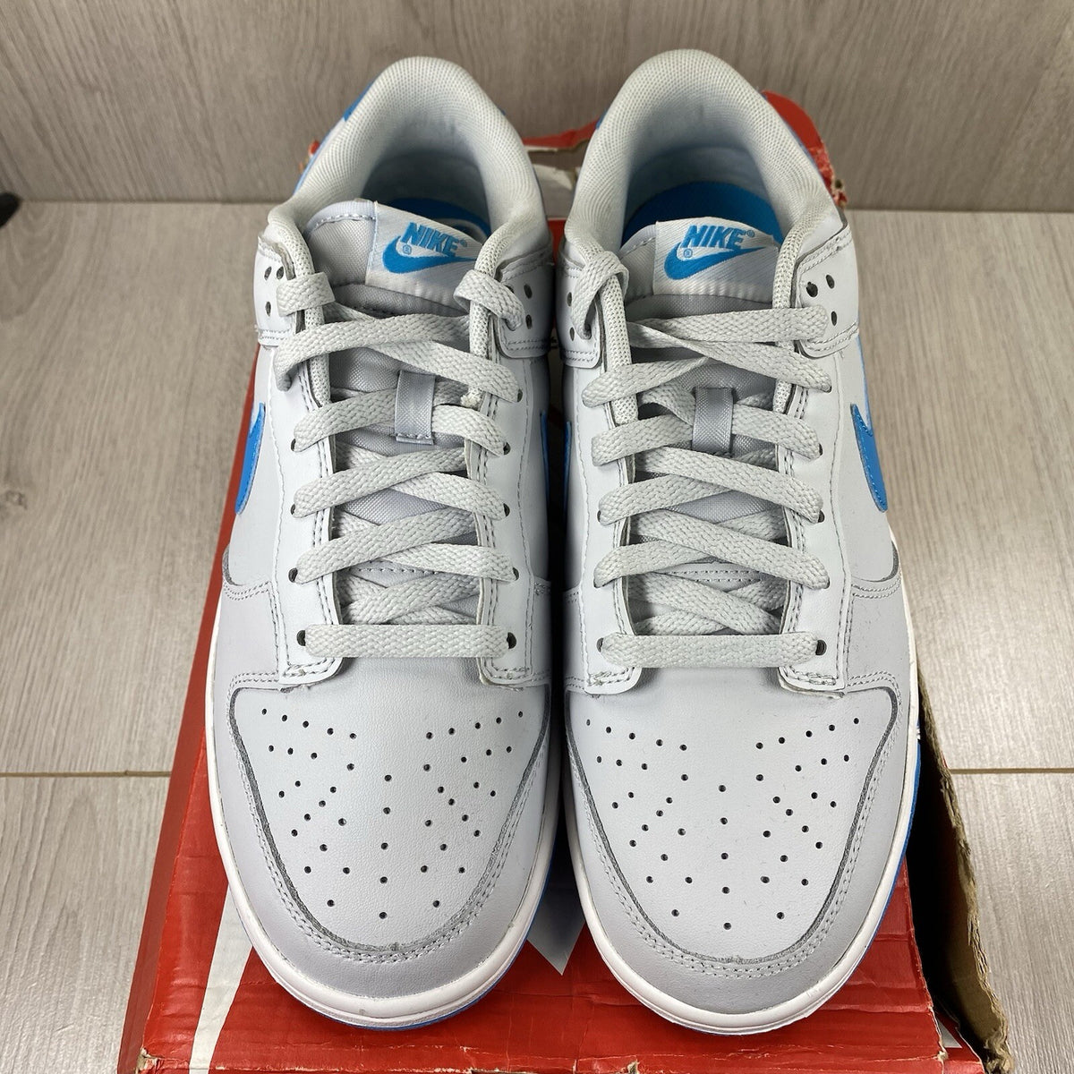 Nike Dunk Low Retro trainers grey with pure platinum accents and signature swoosh logo.