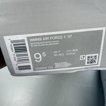 Nike Air Force 1 Low trainers white with black swoosh logo and leather upper.