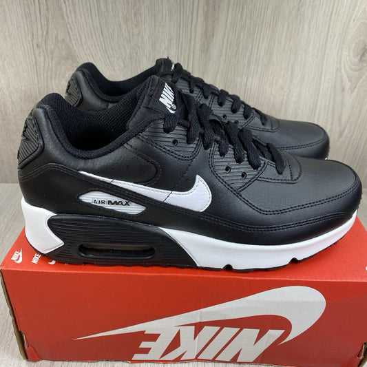 Nike Air Max 90 LTR trainers black leather with white accents and signature logo.