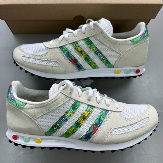 Adidas white LA Trainer with tropical pattern and logo detail on the side.